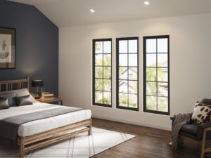 Three picture windows with grid patterns and black frames in a bedroom.