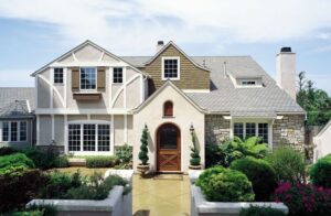 A large, luxurious house with a beautiful front entry door