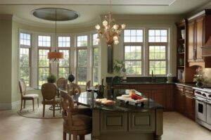 Several vinyl windows adding ambience to a kitchen and adjoining dining room table